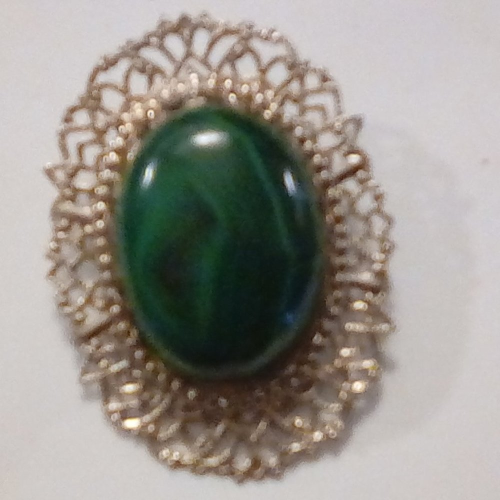 Large cabochon mounted in filigree silver applicad